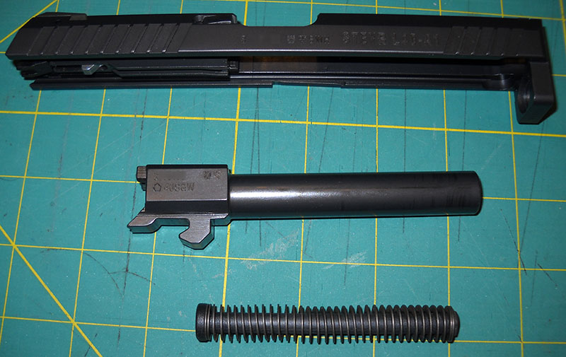 detail, Steyr L40-A1 slide, barrel, and recoil spring, disassembled